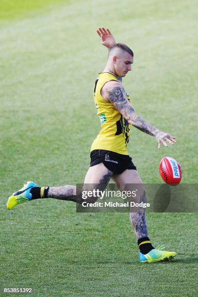 Dustin Martin, a winner of the Brownlow medal last night, kicks the ball during the Richmond Tigers AFL training session at Punt Road Oval on...