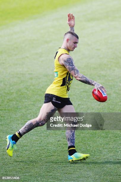 Dustin Martin, a winner of the Brownlow medal last night, kicks the ball during the Richmond Tigers AFL training session at Punt Road Oval on...