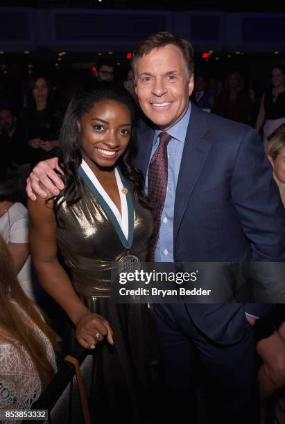 Time Olympic Gold Medal Gymnast Simone Biles and GSLD Master of Ceremonies Bob Costas attend the 32nd Annual Great Sports Legends Dinner To Benefit...