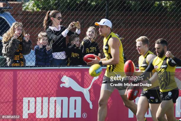 Locked out fans get a glimpse during a Richmond Tigers AFL training session at Punt Road Oval on September 26, 2017 in Melbourne, Australia.