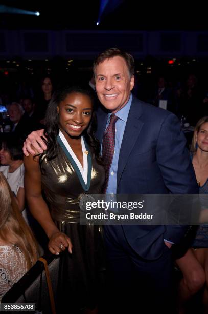 Time Olympic Gold Medal Gymnast Simone Biles and GSLD Master of Ceremonies Bob Costas attend the 32nd Annual Great Sports Legends Dinner To Benefit...