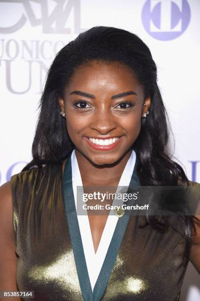 Event honoree, four-time Gold Medalist Simone Biles attends the 32nd Annual Great Sports Legends Dinner at New York Hilton Midtown on September 25,...