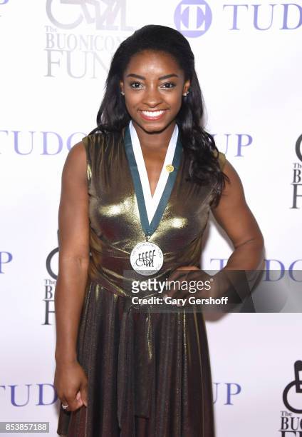 Event honoree, four-time Gold Medalist Simone Biles attends the 32nd Annual Great Sports Legends Dinner at New York Hilton Midtown on September 25,...