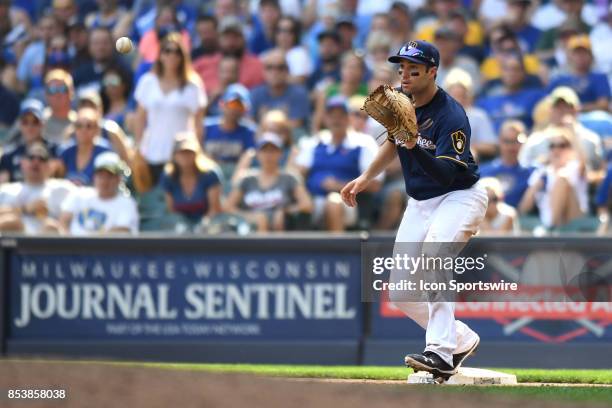 Milwaukee Brewers second baseman Neil Walker forces an out during a game between the and the Chicago Cubs the Milwaukee Brewers on September 23 at...