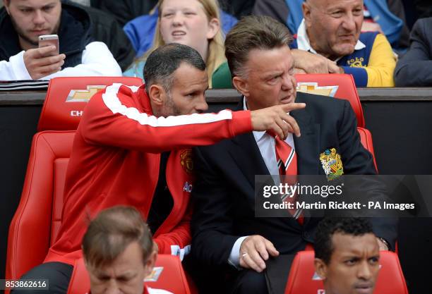 Manchester United manager Louis van Gaal on the bench with his assistant Ryan Giggs before the Barclays Premier League match at Old Trafford,...
