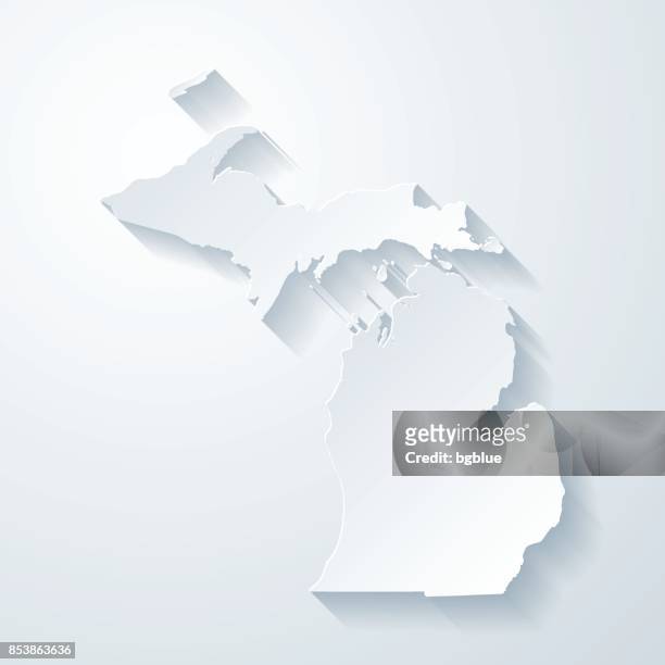 michigan map with paper cut effect on blank background - michigan stock illustrations