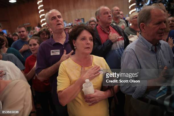 Supporters attend a rally for Republican candidate for the U.S. Senate in Alabama Roy Moore on September 25, 2017 in Fairhope, Alabama. Moore is...