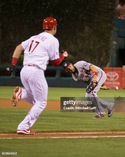 Ryan Zimmerman of the Washington Nationals flips the ball behind his back to throw out Rhys Hoskins of the Philadelphia Phillies in the bottom of the...