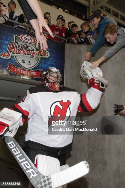 Goaltender Blackwood MacKenzie of the New Jersey Devils high fives fans as he heads to the ice for warm-ups prior to the 2017 Kraft Hockeyville...