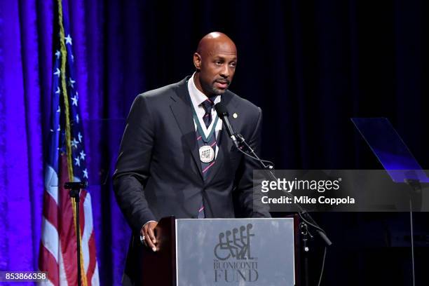 Honoree Alonzo Mourning speaks onstage at the 32nd Annual Great Sports Legends Dinner To Benefit The Miami Project/Buoniconti Fund To Cure Paralysis...