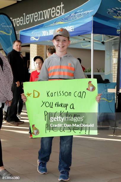 Young fan poses with his homemade sign prior to the Kraft Hockeyville Canada game between the New Jersey Devils and Ottawa Senators at Credit Union...