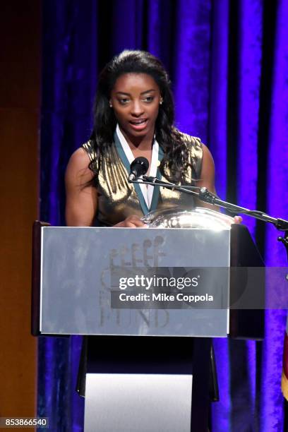 Honoree Simone Biles speaks onstage at the 32nd Annual Great Sports Legends Dinner To Benefit The Miami Project/Buoniconti Fund To Cure Paralysis at...