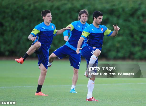 Arsenal captain Mikel Arteta leads the warm up during a training session at London Colney, Hertfordshire.