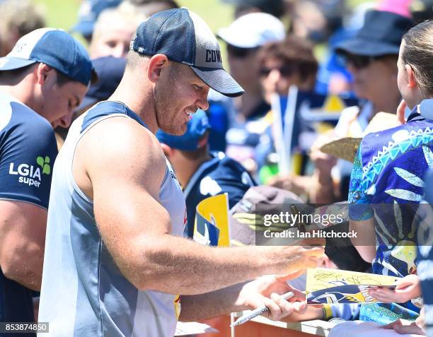 Matthew Scott of the Cowboys signs autographs for fans during a North Queensland Cowboys NRL fans session at 1300SMILES Stadium on September 26, 2017...