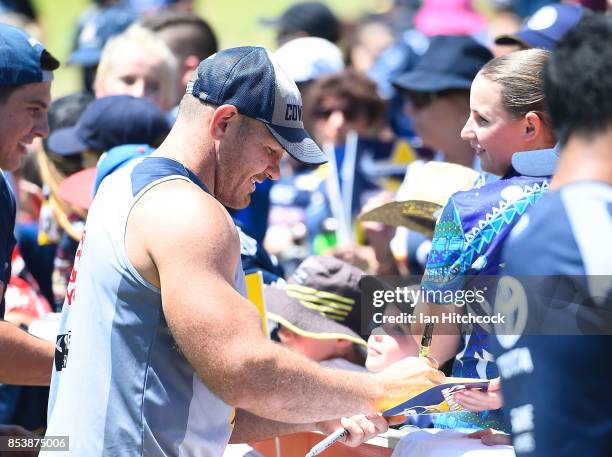 Matthew Scott of the Cowboys signs autographs for fans during a North Queensland Cowboys NRL fans session at 1300SMILES Stadium on September 26, 2017...