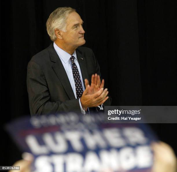 Sen. Luther Strange applauds as he listens to Vice President Mike Pence speak at a campaign rally at HealthSouth Aviation on September 25, 2017 in...