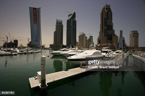 Gleaming new boats rock gently in the newly established Dubai Marina while in the background construction proceeds at breakneck pace on May 1, 2006...