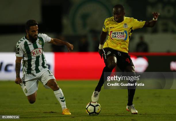 Boavista FC forward Mateus from Angola with Vitoria Setubal midfielder Joao Costinha from Portugal in action during the Primeira Liga match between...