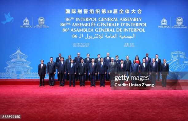 Chinese President Xi Jinping with Secretary General Interpol Jurgen Stock and Meng Hongwei , president of Interpol pose for a group photo before the...