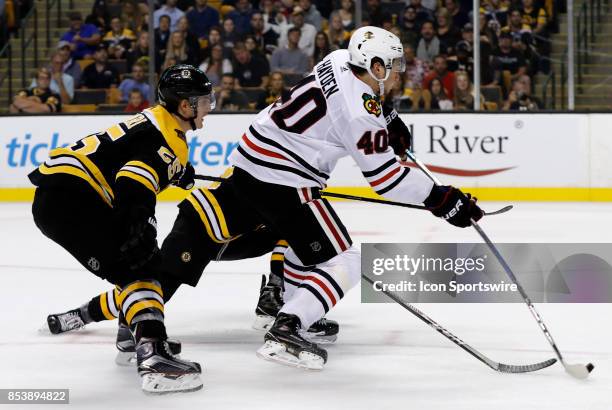 Chicago Blackhawks left wing John Hayden gets the shot away and the goal during a preseason game between the Boston Bruins and the Chicago Blackhawks...