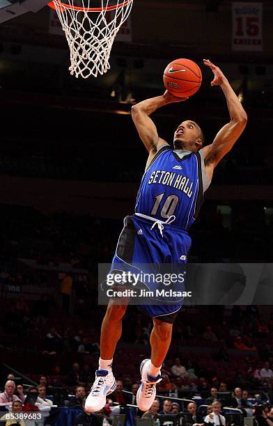 Jordan Theodore of the Seton Hall Pirates drives to the hoop against the Syracuse Orange during the second round of the Big East Tournament at...