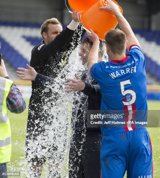 Inverness Dean Brill and Gary Warren soak sky presenter Stephen Craigan as he accepts an Ice Bucket Challenge during the Scottish Premiership match...