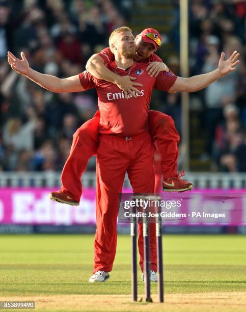 Lancashire Lightning's Andrew Flintoff celebrates with Steven Croft after taking the wicket of Birmingham Bears' Ian Bell with his first ball during...