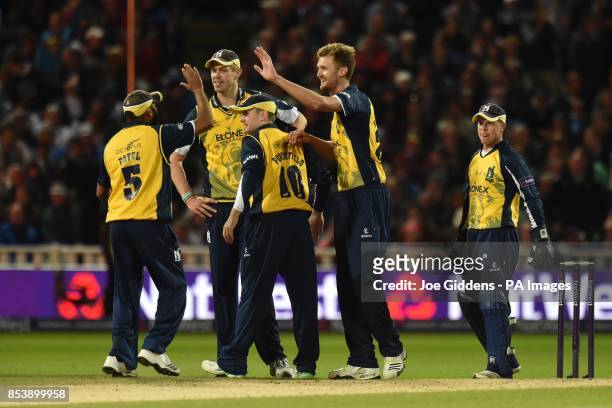 Birmingham Bears' Oliver Hannon-Dalby celebrates taking the wicket of Lancashire Lightning's Jos Buttler during the NatWest T20 Blast Final at...