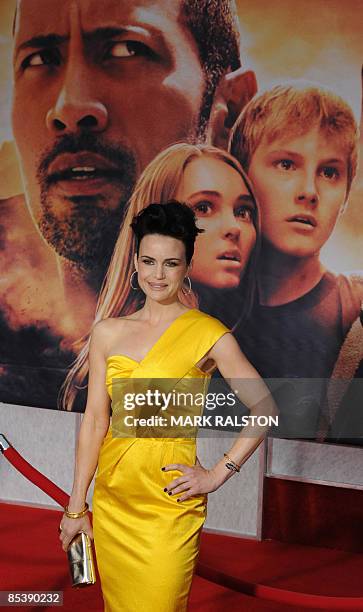 Actor Carla Gugino poses for photos as she arrives for the world premiere of the Disney film "Race to Witch Mountain" at the El Capitan theatre in...