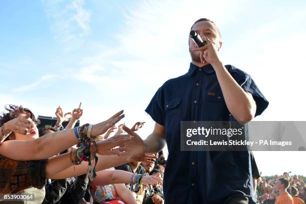 Dan Reynolds of the Imagine Dragons performs during day three of Leeds Festival in Bramham Park, Leeds.