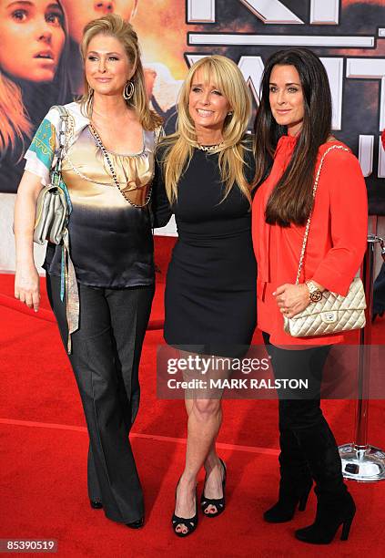 Actress Kim Richards poses for photos with Kathy Hilton and sister Kyle Richards as they arrive for the world premiere of the Disney film "Race to...