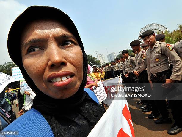Victims of the mud volcano on bungled gas drilling by oil and gas firm Lapindo Brantas, hold a rally in front of the presidential palace in Jakarta...