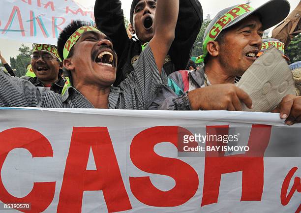 Victims of the mud volcano on bungled gas drilling by oil and gas firm Lapindo Brantas, hold a rally in front of the presidential palace in Jakarta...