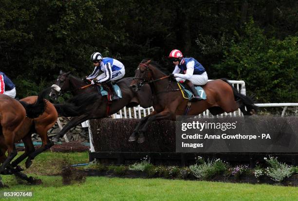 Violets Boy ridden by Brendan Powell clear a fence during the William Hill On Your Mobile Handicap Steeple Chase at Cartmel Racecourse, Cartmel,...
