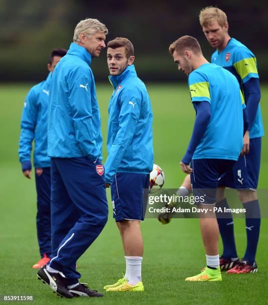 Arsenal's Jack Wilshere looks toward manager Arsene Wenger during a training session at London Colney, Hertfordshire.