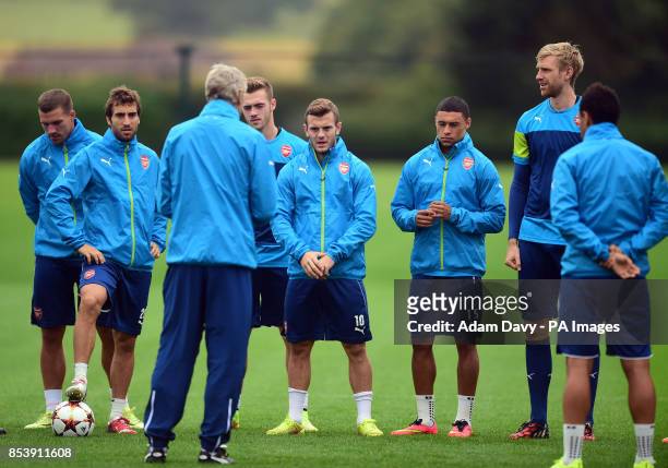 Arsenal's Manager Arsene Wenger talks to his squad during a training session at London Colney, Hertfordshire.
