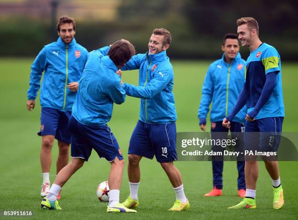 Arsenal's Tomas Rosicky and Jack Wilshere during a training session at London Colney, Hertfordshire.