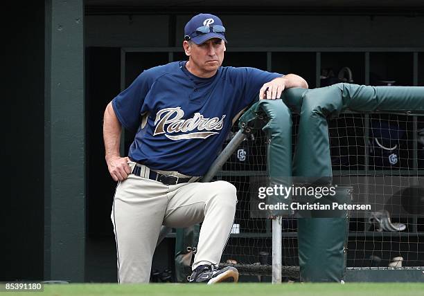 Manager Bud Black of the San Diego Padres looks on from the dugout during the spring training game against the Texas Rangers at Surprise Stadium on...