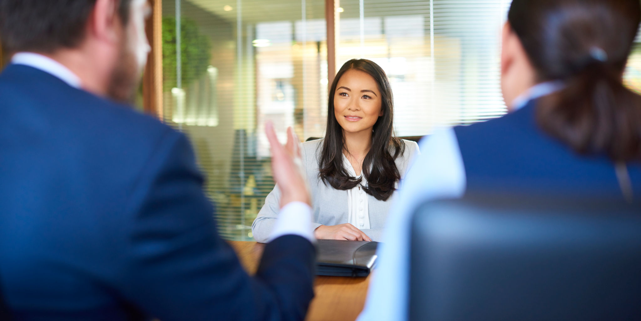 job interviewee listening at the interview table job interviewee listening at the interview table