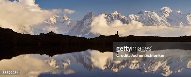 silhouette of hiker - lake chesery stockfoto's en -beelden
