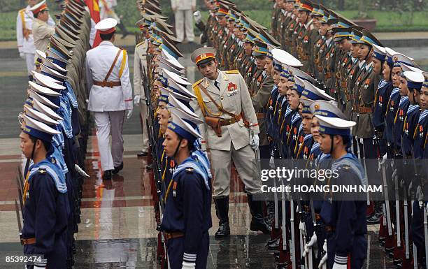 Officers inspect members of the honor guard prior to a welcome ceremony for Malaysia's King Tuanku Mizan Zainal Abidin at the presidential palace in...