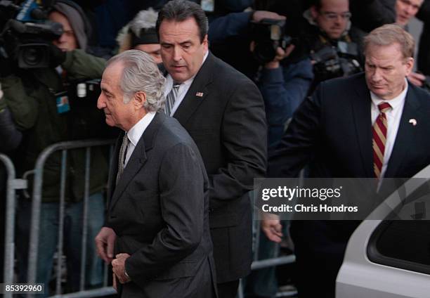 Disgraced financier Bernard Madoff exits a car as he arrives at court on March 12, 2009 in New York City. Madoff was expected to plead guilty to all...