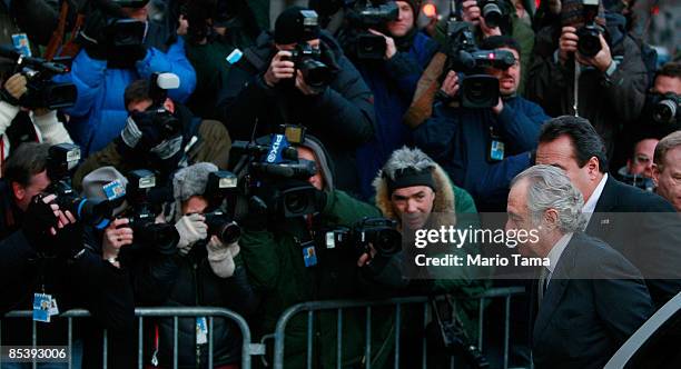 Disgraced financier Bernard Madoff exits a car as he arrives at court March 12, 2009 in New York City. Madoff was expected to plead guilty to all 11...