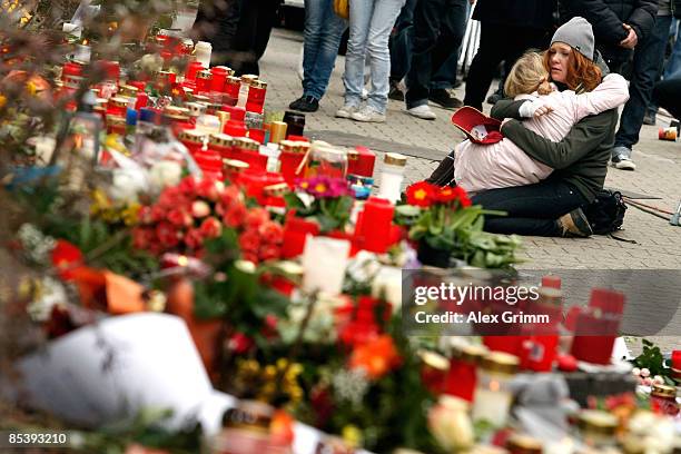 Woman and a girl mourn in front of the Albertville-School Centre on March 12, 2009 in Winnenden near Stuttgart, Germany. 17 - year old Tim...