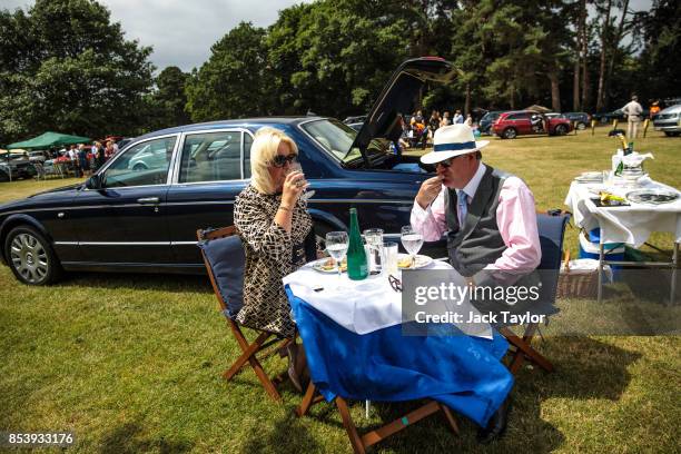 Racegoers eat and drink by their Bentley in a car park on day 3 of Royal Ascot on June 22, 2017 in Ascot, England. The Season in Britain today...