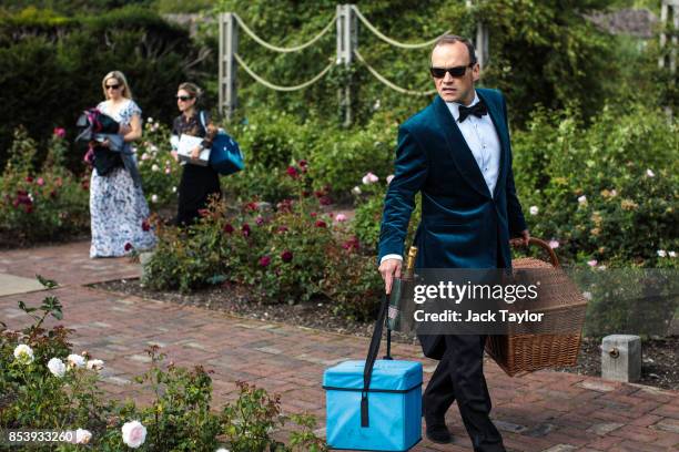 Visitors arrive to the grounds of Glyndebourne opera house with picnics before a production of La Traviata on August 04, 2017 in Lewes, England. The...