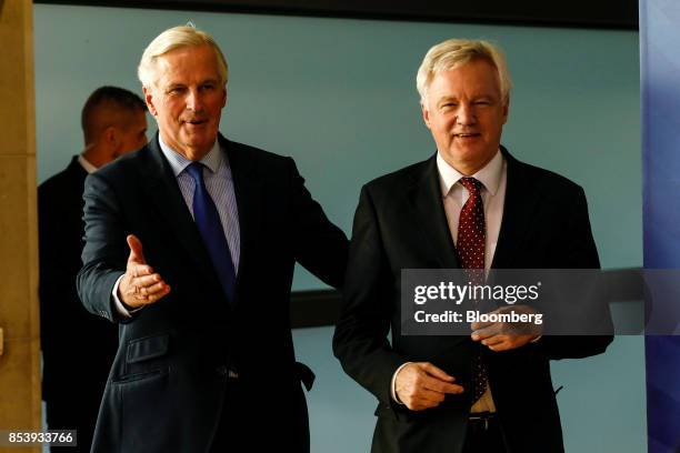 Michel Barnier, chief negotiator for the European Union , left, and David Davis, U.K. Exiting the European Union secretary, arrive for a news...