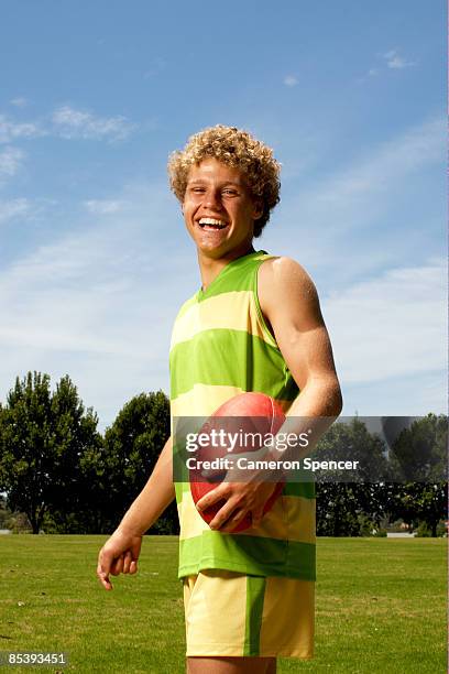 portrait of player laughing towards camera - australian rules football fotografías e imágenes de stock