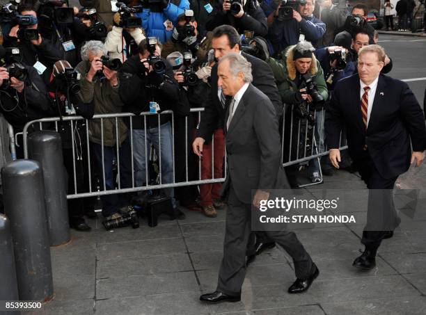 Disgraced Wall Street financier Bernard Madoff arrives at a US Federal Court on March 12, 2009 in New York. Pleading guilty to all 11 counts of fraud...