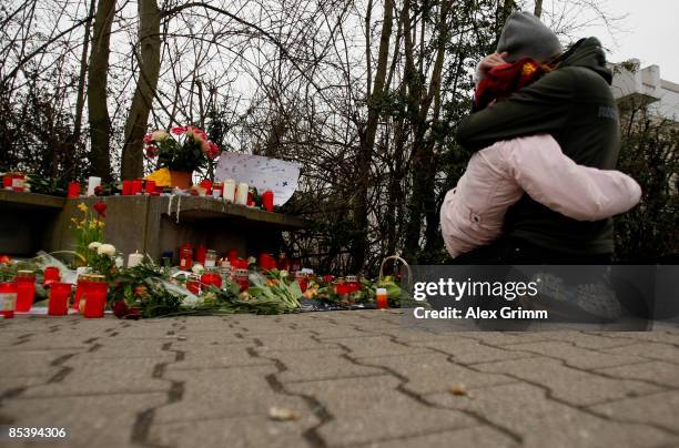 Woman and a girl mourn in front of the Albertville-School Centre on March 12, 2009 in Winnenden near Stuttgart, Germany. 17 - year old Tim...